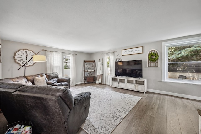 518 Main St, Fairfax, IA 52228 - living area featuring baseboards and wood finished floors