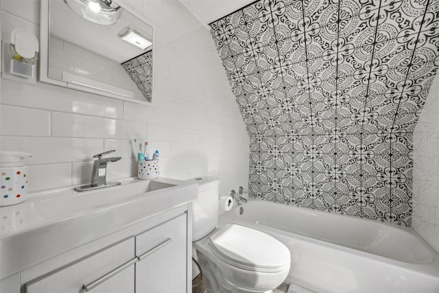 518 Main St, Fairfax, IA 52228 - full bathroom featuring vanity, tile walls, and bathing tub / shower combination