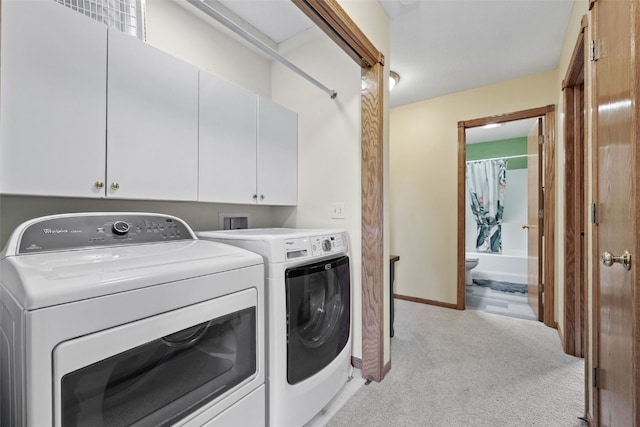 1865 Rock Island Dr, Ely, IA 52227 - washroom with washing machine and dryer, light carpet, and cabinet space