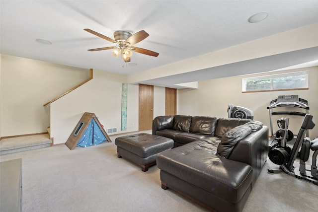 1865 Rock Island Dr, Ely, IA 52227 - carpeted living area featuring stairway and ceiling fan