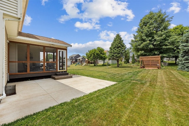 1865 Rock Island Dr, Ely, IA 52227 - view of green lawn with a patio area, a sunroom, and a playground