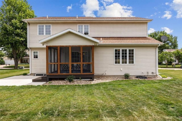 1865 Rock Island Dr, Ely, IA 52227 - back of house featuring a sunroom, a yard, and a shingled roof