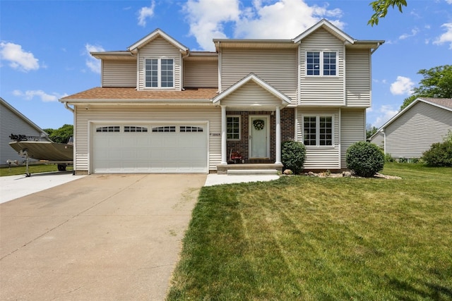 1865 Rock Island Dr, Ely, IA 52227 - view of front of property with concrete driveway, a front yard, and a garage