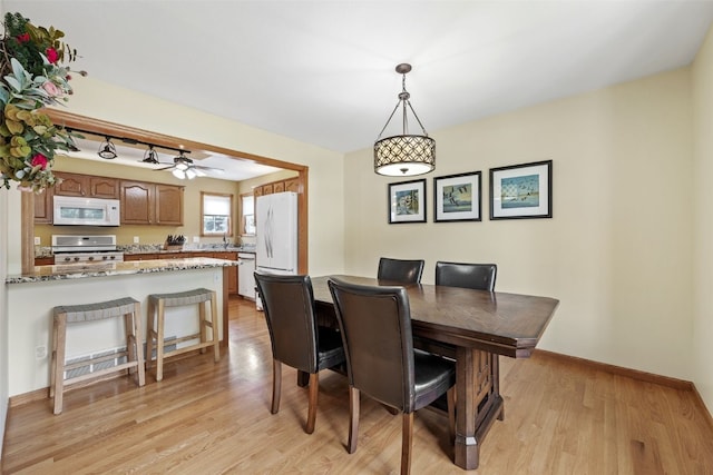 1865 Rock Island Dr, Ely, IA 52227 - dining space with light wood-type flooring and ceiling fan
