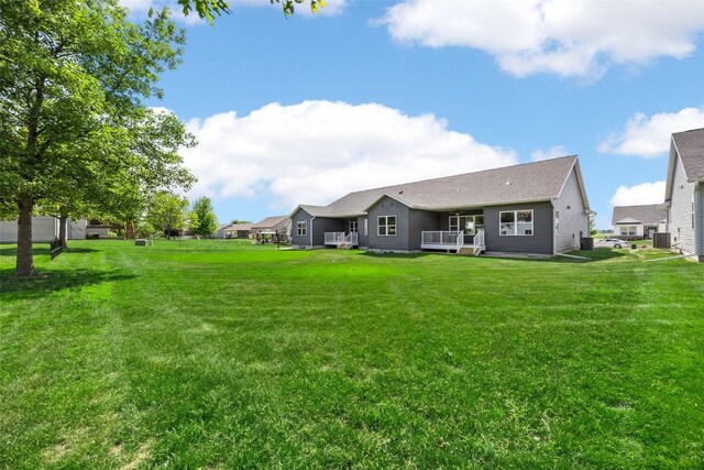 424 15th Ave SW, Mount Vernon, IA 52314 - rear view of house with a yard and a deck