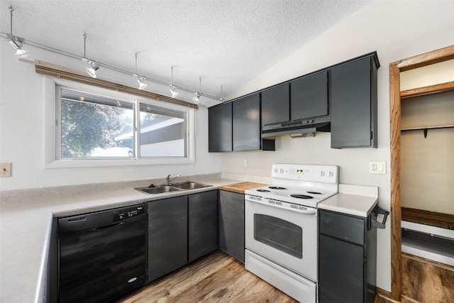 212 4th St SW, Mount Vernon, IA 52314 - kitchen with black dishwasher, white range with electric stovetop, a textured ceiling, under cabinet range hood, and light wood-type flooring