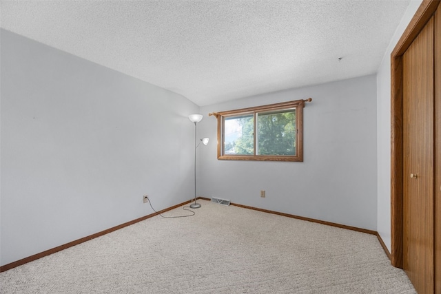 212 4th St SW, Mount Vernon, IA 52314 - unfurnished bedroom featuring carpet floors and a textured ceiling