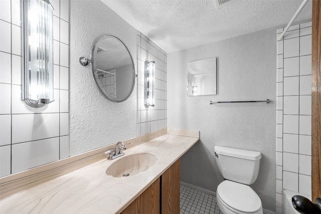 212 4th St SW, Mount Vernon, IA 52314 - full bath featuring a textured wall, a textured ceiling, tile patterned flooring, vanity, and a shower