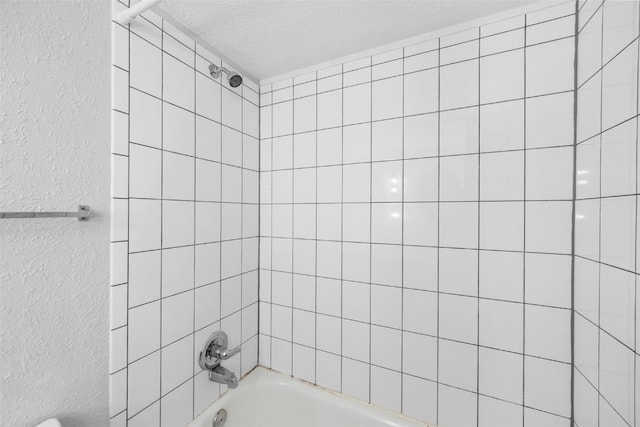 212 4th St SW, Mount Vernon, IA 52314 - full bathroom featuring a textured wall, shower / bathtub combination, and a textured ceiling