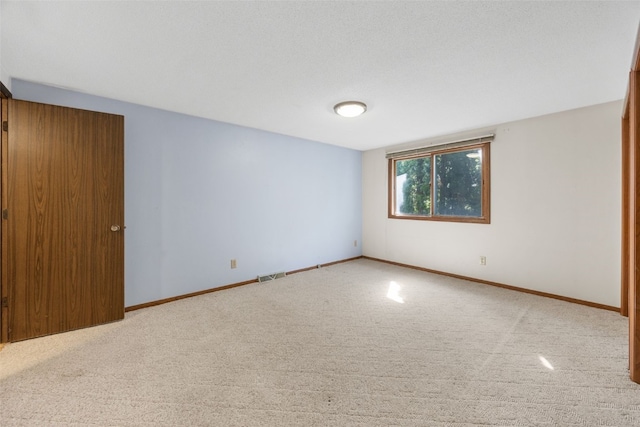 212 4th St SW, Mount Vernon, IA 52314 - carpeted empty room featuring baseboards