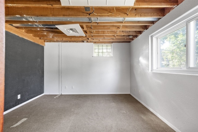 212 4th St SW, Mount Vernon, IA 52314 - below grade area featuring carpet flooring and baseboards
