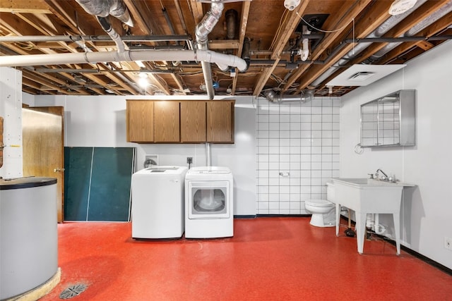 212 4th St SW, Mount Vernon, IA 52314 - washroom featuring washer and clothes dryer and water heater