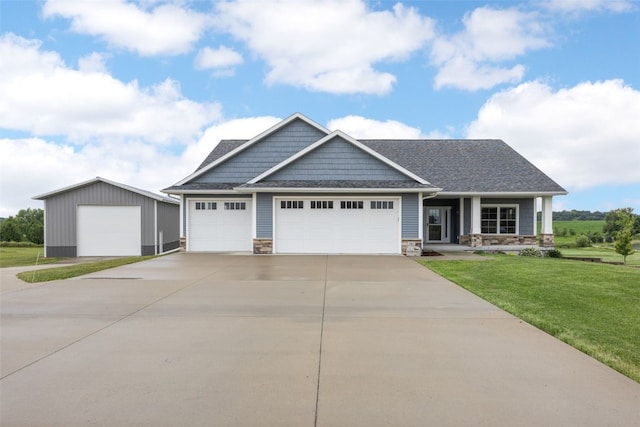 3363 Southridge Dr, Amana, IA 52203 - craftsman-style home with a front lawn, driveway, stone siding, and a porch