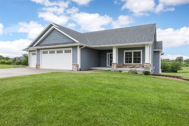 3363 Southridge Dr, Amana, IA 52203 - craftsman-style home featuring stone siding, an attached garage, a front lawn, and driveway