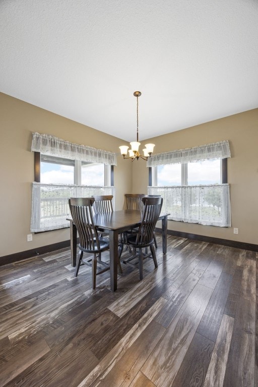 3363 Southridge Dr, Amana, IA 52203 - dining area with dark wood-style flooring and a chandelier