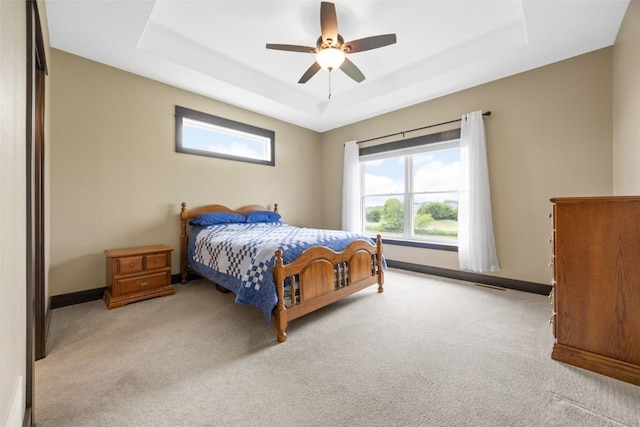 3363 Southridge Dr, Amana, IA 52203 - bedroom featuring a raised ceiling, carpet, and ceiling fan