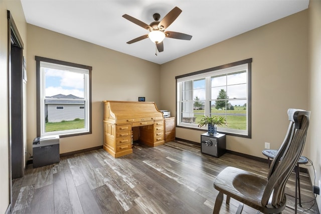 3363 Southridge Dr, Amana, IA 52203 - office space with ceiling fan and dark wood-type flooring