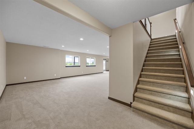 3363 Southridge Dr, Amana, IA 52203 - staircase featuring carpet floors and recessed lighting