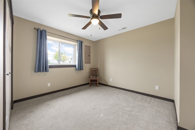 3363 Southridge Dr, Amana, IA 52203 - empty room with light colored carpet and a ceiling fan