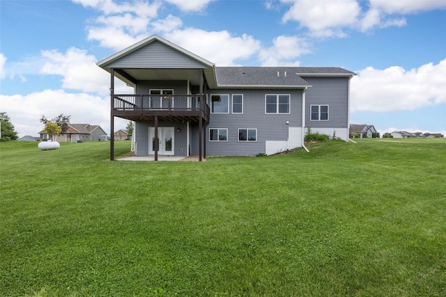 3363 Southridge Dr, Amana, IA 52203 - rear view of house with a lawn, a patio area, a deck, and a shingled roof