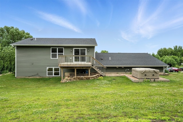 1102 S St, Urbana, IA 52345 - back of house featuring a hot tub, a wooden deck, a lawn, and stairway