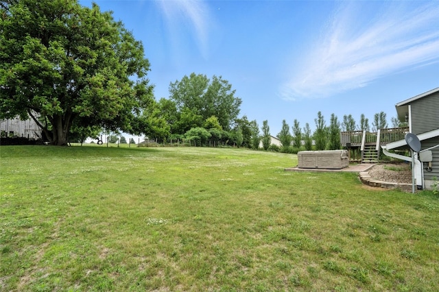 1102 S St, Urbana, IA 52345 - view of green lawn with a deck