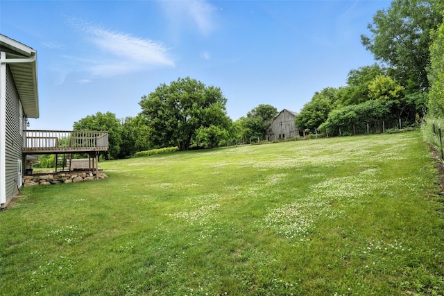 1102 S St, Urbana, IA 52345 - view of green lawn featuring a wooden deck