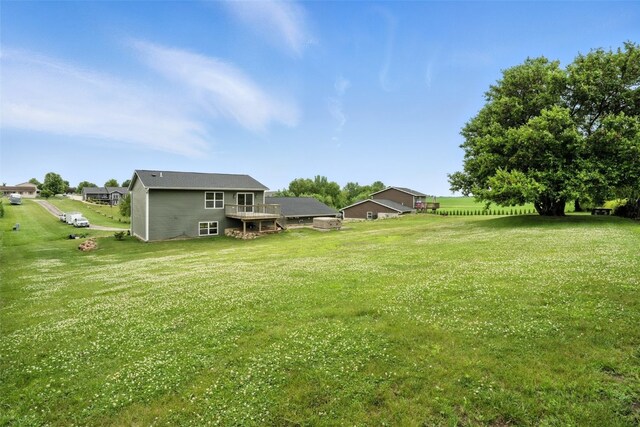 1102 S St, Urbana, IA 52345 - view of grassy yard with a wooden deck
