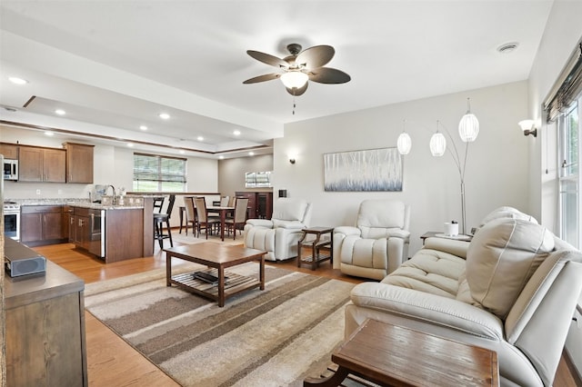 1102 S St, Urbana, IA 52345 - living area featuring ceiling fan, light wood-style floors, and recessed lighting