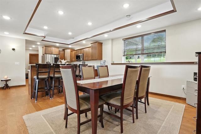 1102 S St, Urbana, IA 52345 - dining area with a raised ceiling, light wood-style floors, and recessed lighting