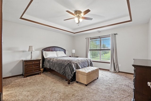 1102 S St, Urbana, IA 52345 - carpeted bedroom featuring a raised ceiling and ceiling fan