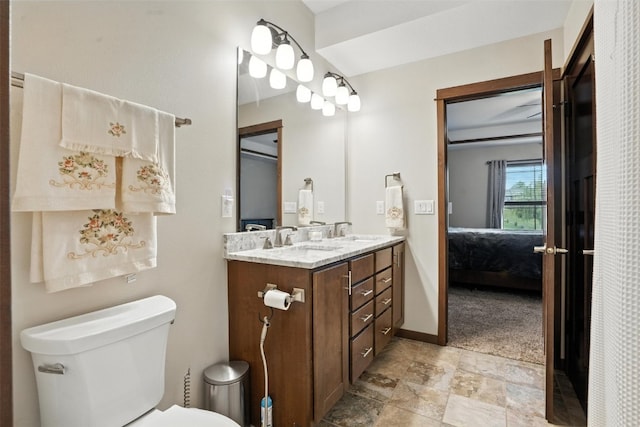 1102 S St, Urbana, IA 52345 - bathroom featuring ensuite bathroom, double vanity, and stone finish flooring