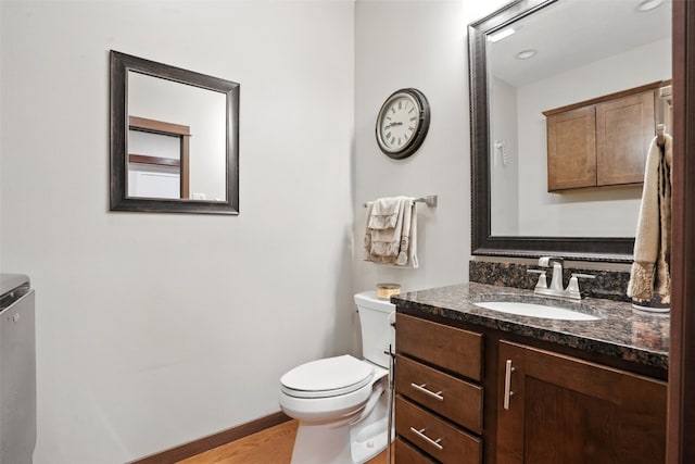 1102 S St, Urbana, IA 52345 - half bath with vanity and wood finished floors