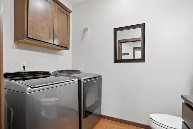 1102 S St, Urbana, IA 52345 - laundry area featuring washer and dryer and light wood finished floors