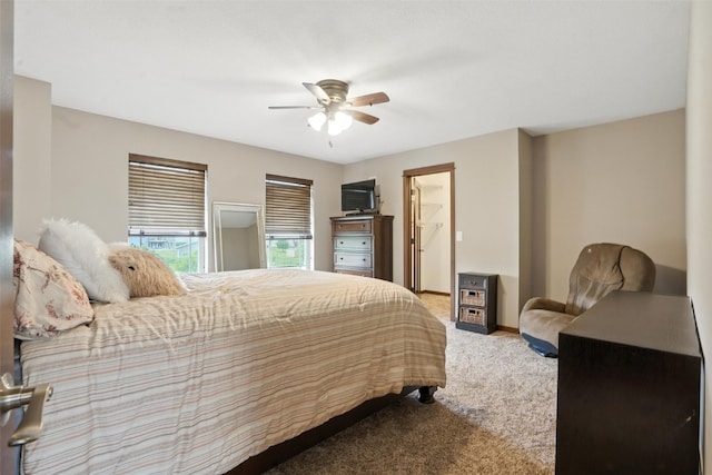 1102 S St, Urbana, IA 52345 - carpeted bedroom featuring a ceiling fan and baseboards