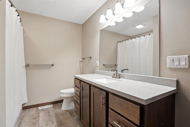 1102 S St, Urbana, IA 52345 - bathroom featuring vanity and stone finish flooring