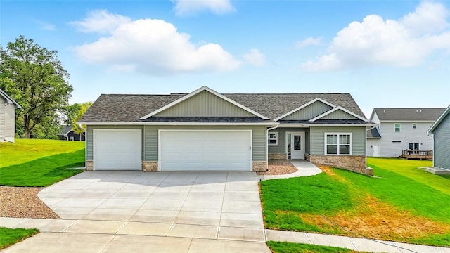 1002 Croell Ave, Tiffin, IA 52340 - craftsman-style home with a garage, stone siding, driveway, a front lawn, and a shingled roof
