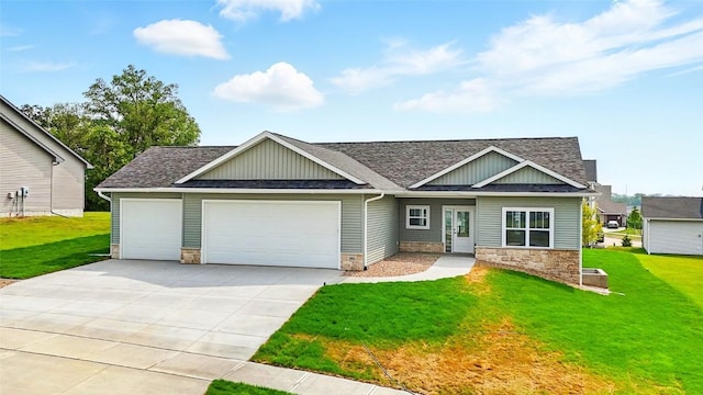 1002 Croell Ave, Tiffin, IA 52340 - craftsman inspired home with an attached garage, stone siding, roof with shingles, concrete driveway, and a front yard