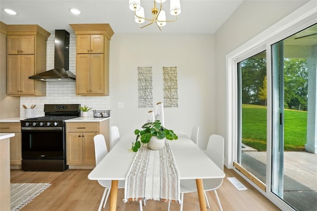1002 Croell Ave, Tiffin, IA 52340 - dining area with light wood finished floors, a chandelier, and recessed lighting