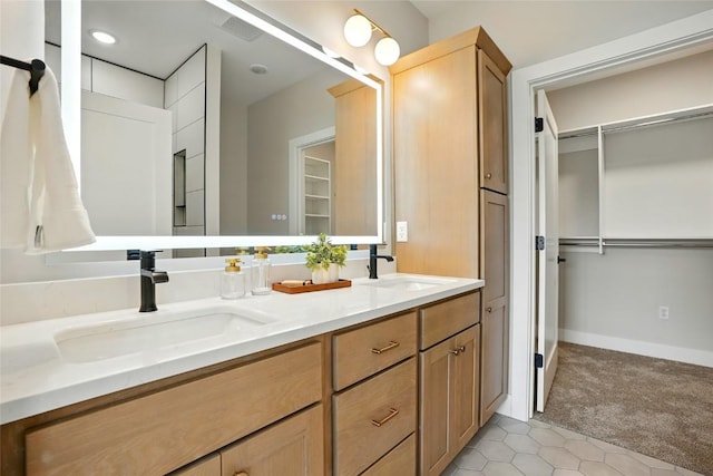 1002 Croell Ave, Tiffin, IA 52340 - full bathroom with double vanity, a spacious closet, and tile patterned flooring