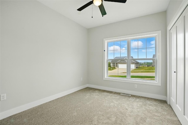 1002 Croell Ave, Tiffin, IA 52340 - unfurnished room with light colored carpet and ceiling fan