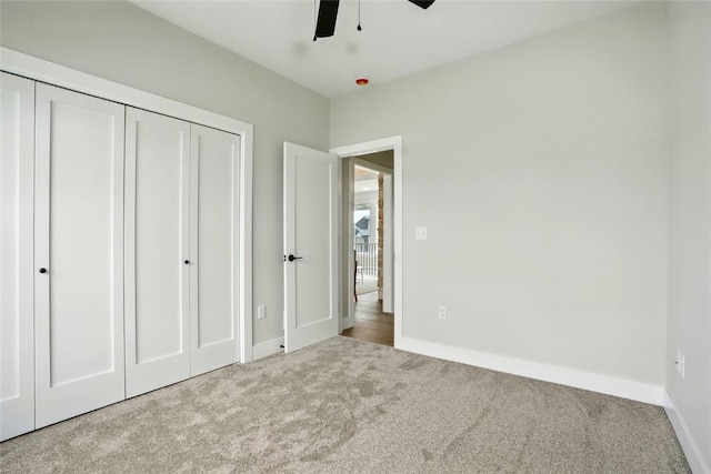 1002 Croell Ave, Tiffin, IA 52340 - unfurnished bedroom with carpet flooring, a closet, and a ceiling fan