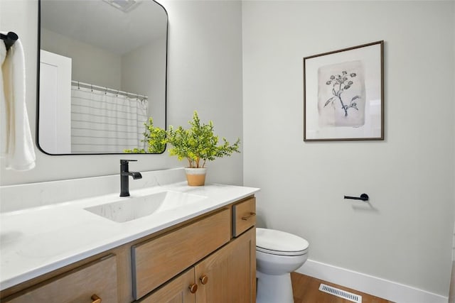 1002 Croell Ave, Tiffin, IA 52340 - full bathroom featuring vanity and wood finished floors