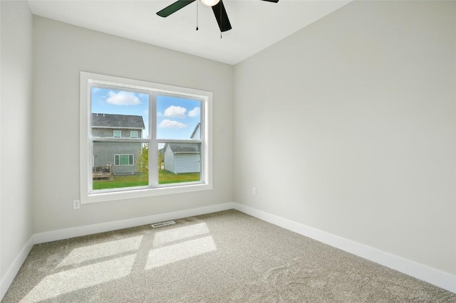 1002 Croell Ave, Tiffin, IA 52340 - empty room with carpet flooring and a ceiling fan