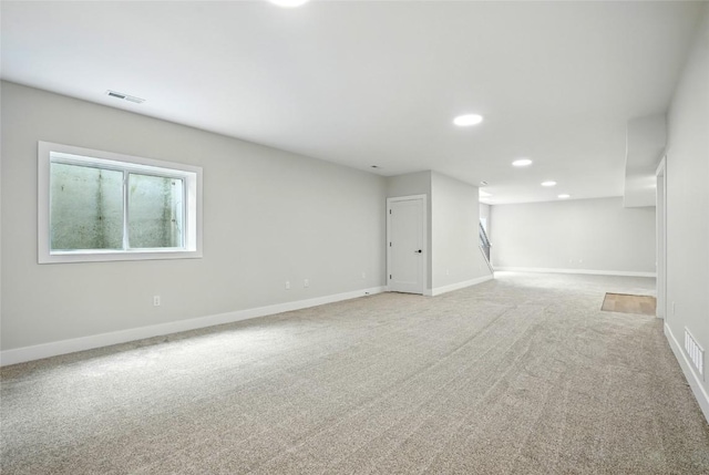 1002 Croell Ave, Tiffin, IA 52340 - spare room featuring light colored carpet and recessed lighting