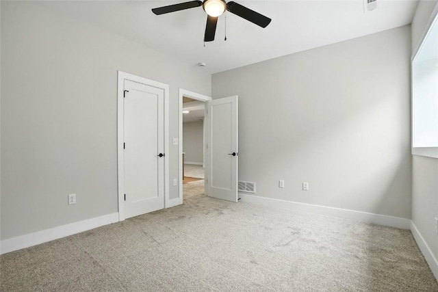 1002 Croell Ave, Tiffin, IA 52340 - unfurnished bedroom featuring carpet and ceiling fan