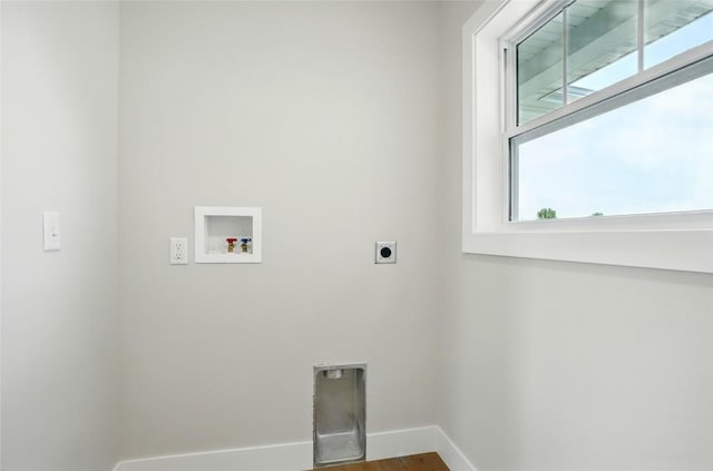 1002 Croell Ave, Tiffin, IA 52340 - washroom featuring hookup for an electric dryer, hookup for a washing machine, and wood finished floors