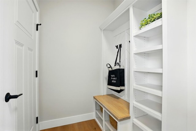 1002 Croell Ave, Tiffin, IA 52340 - mudroom featuring baseboards and wood finished floors
