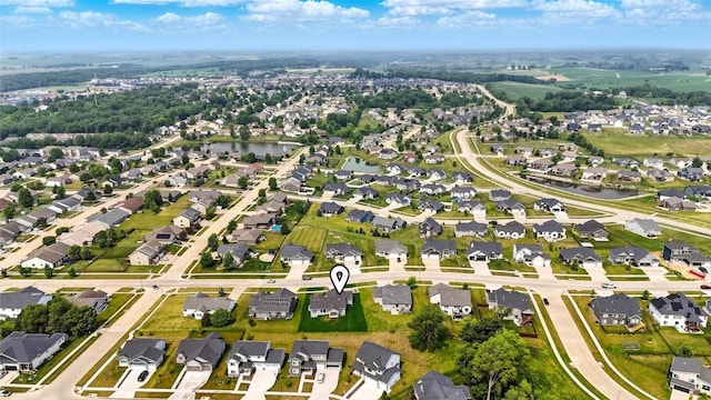 1002 Croell Ave, Tiffin, IA 52340 - aerial overview of property's location with nearby suburban area and a large body of water