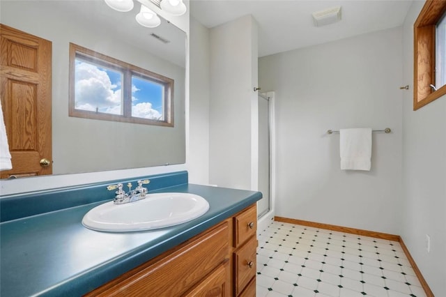 4317 Indian Tl NE, Solon, IA 52333 - bathroom with tile patterned floors, a stall shower, and vanity